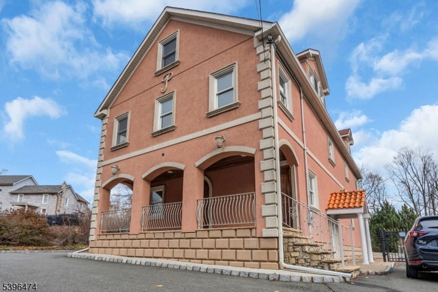 Don't miss this rare opportunity to own an incredibly versatile property just minutes from Lake Hopatcong. Ideal for remote work, private practice, or a small business setup, this spacious home offers flexibility on every level. The first floor features a highly adaptable layout with 3 bedrooms, a cozy living room, two bonus rooms perfect for offices or guest use, a convenient kitchenette, half bath, and charming terracotta flooring an excellent setup for mixed-use or extended living arrangements. Upstairs, the second floor offers a warm and inviting living room, a sun-filled eat-in kitchen with custom cabinetry, 3 additional bedrooms, and a full bathroom, all highlighted by beautiful hardwood floors. The fully finished walk-up attic on the third level provides a wide-OPEN Space ideal for a playroom, studio, or additional living area limitless potential to FIT your needs. A full unfinished basement with its own private entrance adds even more versatility, suitable for a gym, workshop, storage, or future expansion. Additional features include knotty pine doors, hardwood and terracotta flooring throughout, two separate HVAC units, multi-zone electrical, and a private laundry/utility entrance. Set on a gated lot with ample off-street parking, this unique property blends flexibility, charm, and a prime location.