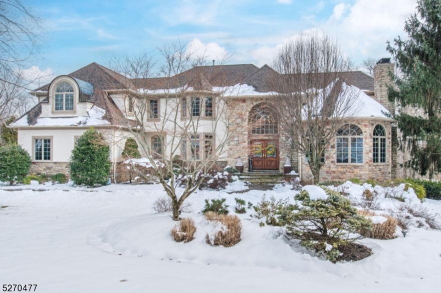 Welcome to this magnificent estate loaded with Palladian style windows bringing in the brilliant natural sunlight. As one enters the grand 2 story foyer one starts to notice its uncompromising quality and craftsmanship.The gourmet kitchen offers a Thermadore stove, 9-foot granite center island, Sub-Zero refrigerator and breakfast area that leads to the enormous deck w/views of the breathtaking 2 acre private secluded oasis. Fabulous great room boasts a wall of windows and wood-burning fireplace. A gas fireplace warms the living room that adjourns to the library/study room. There is a main level in-law suite w/private bath and direct access outside. The beautifully crafted staircase welcomes you to the second floor primary bedroom w/balcony and bath suite with jetted tub, opulent shower, bidet and 3 walk in closets. Three additional bedrooms include en suite baths and the third bedroom has a bath that opens also to the hallway. As if this is not enough, the incredible walkout basement has a private theatre room and unbelievable detailed crafted wine/poker room with a gated bar entrance. Additionally, there is an exercise room, full bath, office, game room and billiard room with french doors that lead to the under deck shed and extraordinary back yard sanctuary! The incredible property features an in-ground salt water pool with waterfalls, fountains, a slide, swim up bar, gazebo, outdoor kitchen and pavilion. Own your own piece of paradise!