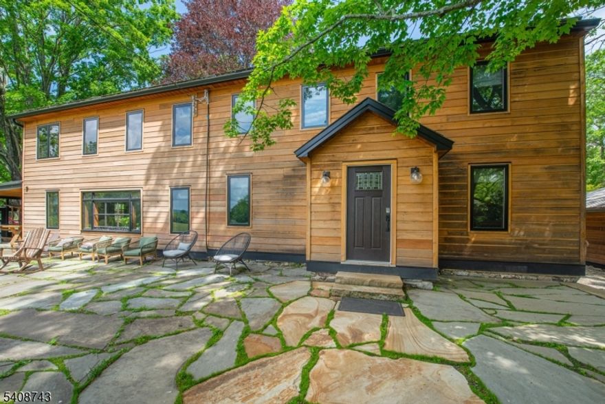 Fly in with your plane and park it in your private hangar! 2500' runway! 800' elevation  Listed on  the aeronautical charts as a private airport named  Mt Pleasant.  Welcome to Whispering Pines Estate, a rare 208-acre sanctuary in Columbia, NJ. This lucrative Airbnb retreat features a rustic-modern main house, a detached chef's kitchen/dining lodge for 12, and a private guest house. There is also an office/spa retreat building and a barn.  Luxury amenities include an in-ground heated pool, hot tub, sauna, yoga studio, and even a private airstrip with a hangar. Enjoy miles of pristine hiking trails, scenic vistas, and organic gardens. Perfect as a private residence, wellness venue, or high-end investment. Experience ultimate secluded luxury.. This is one of a kind, don't miss it!