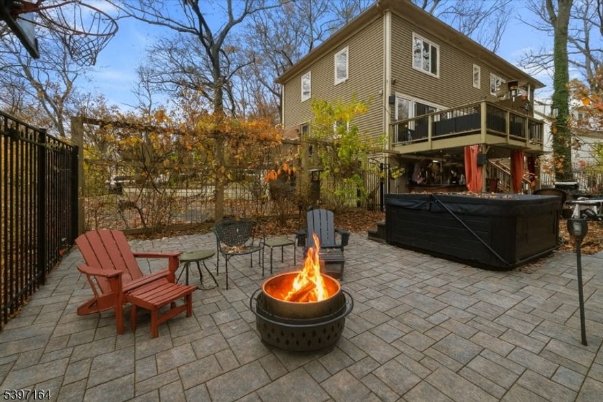 Welcome to this inviting colonial set on a generous 0.41-acre lot in the desirable Erskine Lake section of Ringwood, where optional lake membership offers a true lifestyle bonus. Surrounded by peaceful, wooded privacy, this home provides the perfect blend of tranquility and convenience close to major commuting routes, shopping, parks, and all that Ringwood's scenic community has to offer.  Inside, you'll find five bedrooms and three-and-a-half baths, along with an impressive amount of living and entertaining space. The main level features a spacious kitchen with a center island and large dining area, a comfortable living room with a fireplace, family room and full bath.  Upstairs, the primary suite offers a cozy fireplace and private bath. Three additional bedrooms and a full hall bath with laundry complete the second level.  The walk-out lower level includes a recreation room, an additional bedroom, a powder room, and a utility area perfect for guests or a home office.  Step outside to enjoy a paver patio, composite deck, and outdoor bar; your own warm-weather oasis! Additional features include hardwood floors, central air,  boiler (2024), and septic (2019).  This is a wonderful opportunity to make a spacious, beautifully situated home your own in one of Ringwood's most picturesque neighborhoods.