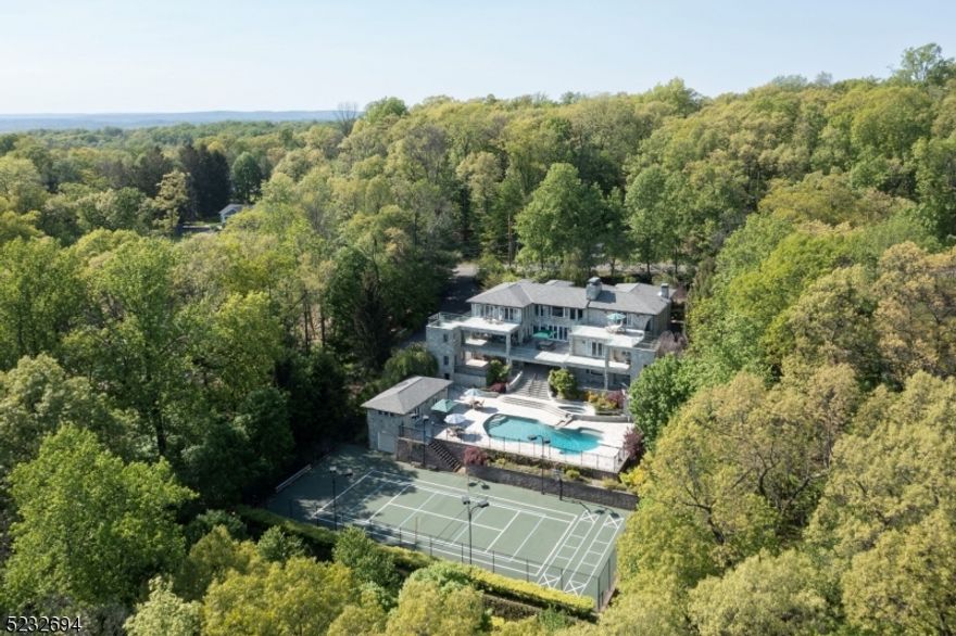Welcome to your dream luxury home nestled in the prestigious town of Watchung, NJ. This exquisite residence offers an unparalleled living experience with a plethora of lavish amenities and breathtaking views from every room. Step inside and be greeted by a grand foyer, adorned with elegant details and an inside out feel to the terraces.The primary suite is the perfect sanctuary to unwind and recharge with a large, sizable steam shower, a separate rejuvenating sauna, and a deluxe Jacuzzi tub. In addition to all the bedrooms, discover the art room, a dedicated yoga or workout room, a music room, a theater, and an office. An in-law suite is added on the lower level accessible with the convenience of an elevator. Included is a home system for music, heat/cool, and lights accessed via your phone, along with a full house generator should you lose power. The gourmet kitchen is a culinary enthusiast's dream, equipped with top-of-the-line appliances, custom cabinetry, and ample countertop space along with a food elevator to the pool. The magnificent pool has a spa, and for recreation a large fenced-in private tennis/pickle ball court with sports lighting for night competitions. Do not miss the opportunity to experience the epitome of elegance, comfort, and tranquility in Watchung, NJ. Schedule a private tour today and let this extraordinary home redefine luxury living.
