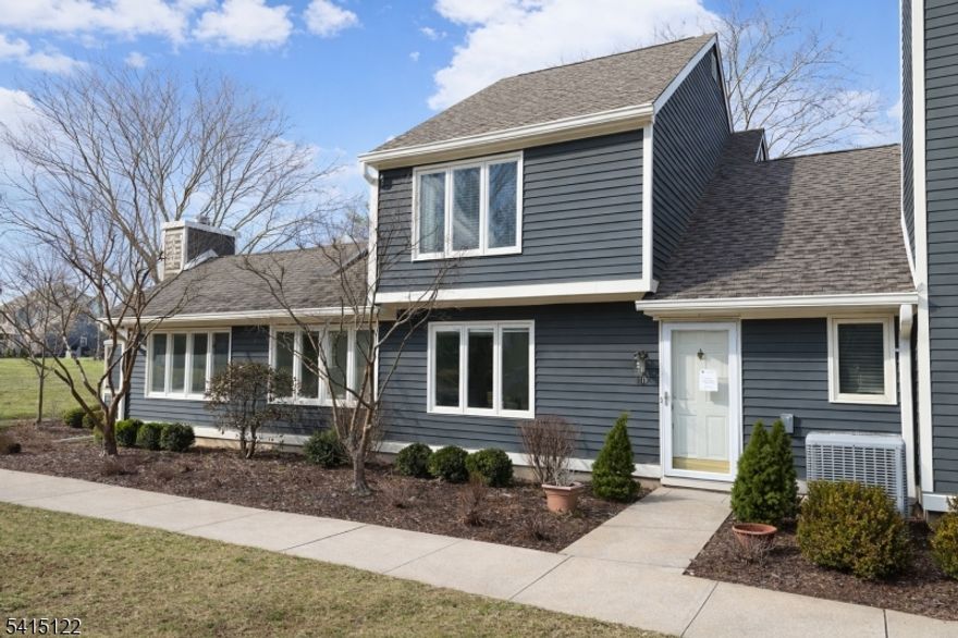 Welcome to 110 Village Drive, a beautifully maintained home filled with natural light and thoughtful updates. The entire interior has been freshly painted, creating a crisp, rich atmosphere throughout.  Sunlight pours into the home from multiple windows and skylights, brightening the living spaces throughout the day. The skylights continue to the second floor, where the main bedroom enjoys wonderful natural light and a peaceful retreat-like feel.  The kitchen offers convenient access to the laundry room, garage, and outdoor patio perfect for easy everyday living and entertaining. Just off the main living space is a welcoming bonus family room featuring a wood burning fireplace and large windows that bring in even more beautiful sunlight.Additional highlights include excellent storage with a spacious walk-in attic on the second floor, generous nearby guest parking, and close proximity to community amenities including the pool and tennis courts.  A bright, cheerful home in a convenient location this is easy living in one of Basking Ridge's most desirable communities.  Newer HVAC 2022 and Water Heater 2018.