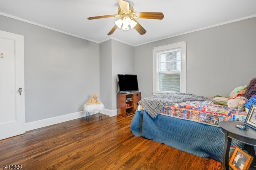 Well-maintained 3BR Tudor Colonial just steps from Verona Park and set in the award-winning Forest Avenue School district! This inviting home is rich in character, featuring a rounded-top entry door, leaded glass windows, and gleaming wood floors throughout. The EIK with charming breakfast nook flows seamlessly into the main level, complete with a convenient powder room. Upstairs offers three bedrooms and a full bath, while the walk-up attic additional space. Enjoy a well maintained basement rec room, an enclosed rear porch perfect for relaxing, and a level yard offering both sun and shade. Additional highlights include abundant storage and a 1-car detached garage. Ideally located near top-rated schools, shopping, NYC transportation, and major highways with easy access to Verona Park this home delivers the perfect blend of timeless charm, prime location, and endless potential.