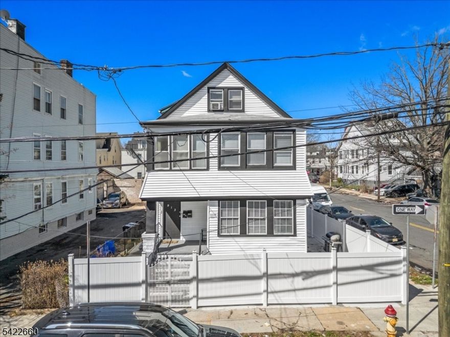 Fully Renovated 2-family with Bonus Living Space & Ample Parking! A beautifully renovated multi-family property offering exceptional space, versatility, and income potential. This turnkey property features a total of 10+ bedrooms and 4 full bathrooms across multiple levels, making it perfect for both investors and Owner-occupants alike. The 1st floor unit offers 3 spacious bedrooms and 1 full bathroom with modern finishes throughout. The 2nd floor unit Boasts an expansive layout with 4 bedrooms and 1 full bathroom, ideal for larger households. The finished attic (3rd level) adds even more value with a private 1 bedroom, 1 full bathroom setup, while the fully finished basement includes 2 bedrooms and 1 full bathroom. This home has been fully renovated from top to bottom, featuring updated flooring, kitchens, bathrooms, and mechanicals. A rare find in Newark, the property also includes a large parking lot in the rear, providing ample off-street parking for multiple vehicles. Conveniently located near major highways, public transportation, schools, and shopping. Don't miss this incredible opportunity to own a high-income producing, move-in ready property in a rapidly growing area!