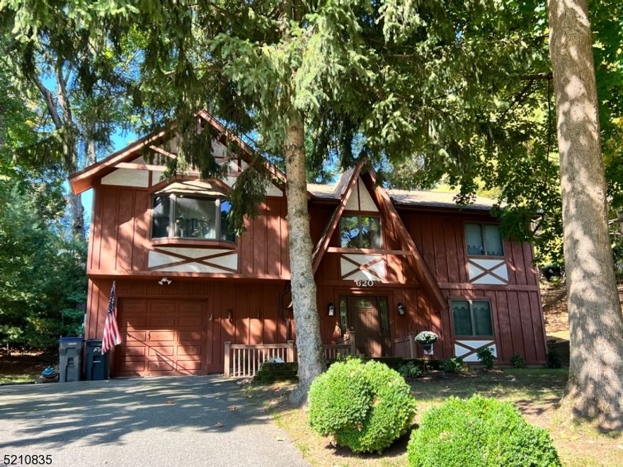 For comp purposes only...interior is all original. ..easement was required so next door neighbor could get a CO when it was built. The driveway would have been too steep if It was only on their property. Fixer Upper.