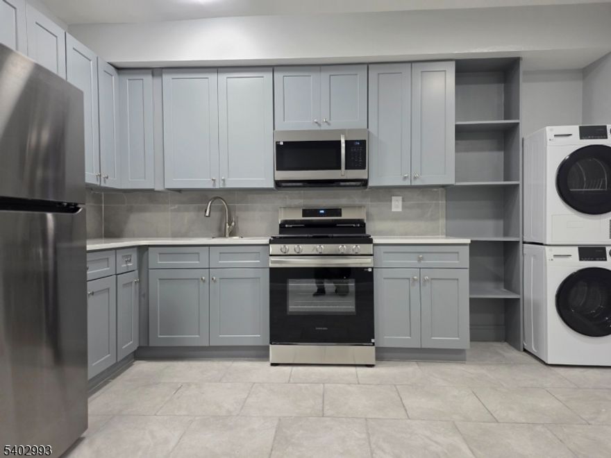 New construction luxury apartment that boasts an open floor concept that has 2 bedrooms 1 bath with tiles floors throughout and a walkout back private Patio. Exquisite bathroom with floor to ceiling tile walls, modern eat-in kitchen with all high-end stainless-steel appliances and soft close shaker style cabinets. This apartment also come with its in-unit laundry. Central Heating & Air Conditioning. Conveniently located near public transportation and Branch brook park