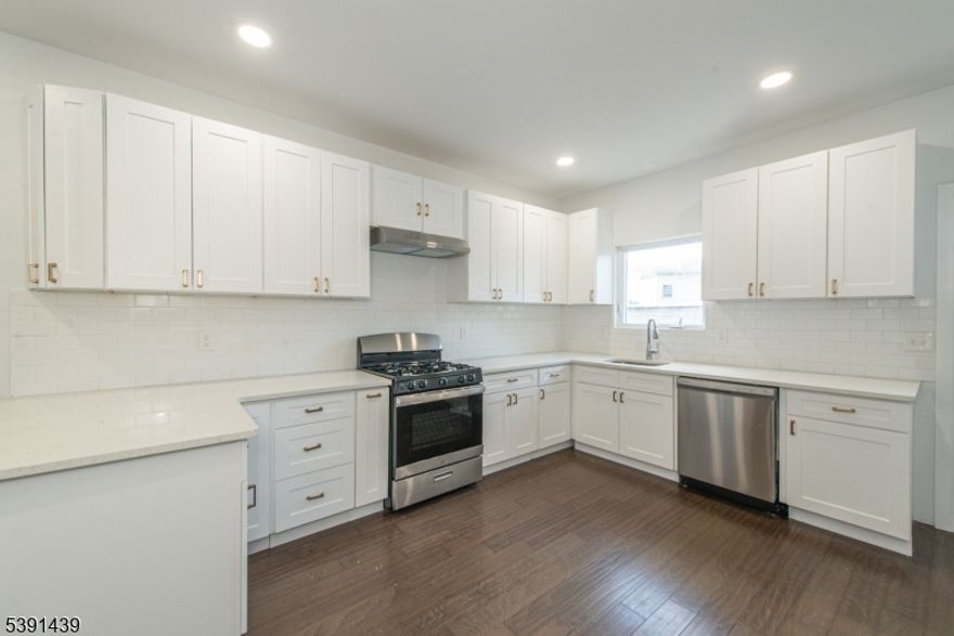 Amazing location! Amazing location! This REO two family home that is 5 years young and never been occupied! Home features 2 units, hard wood/vinyl floors trough out, open layout, separate utilities, central Air, private back yard, driveway, 1 car garage and so much more! Just steps away from the park, public transportation, shopping, schools.