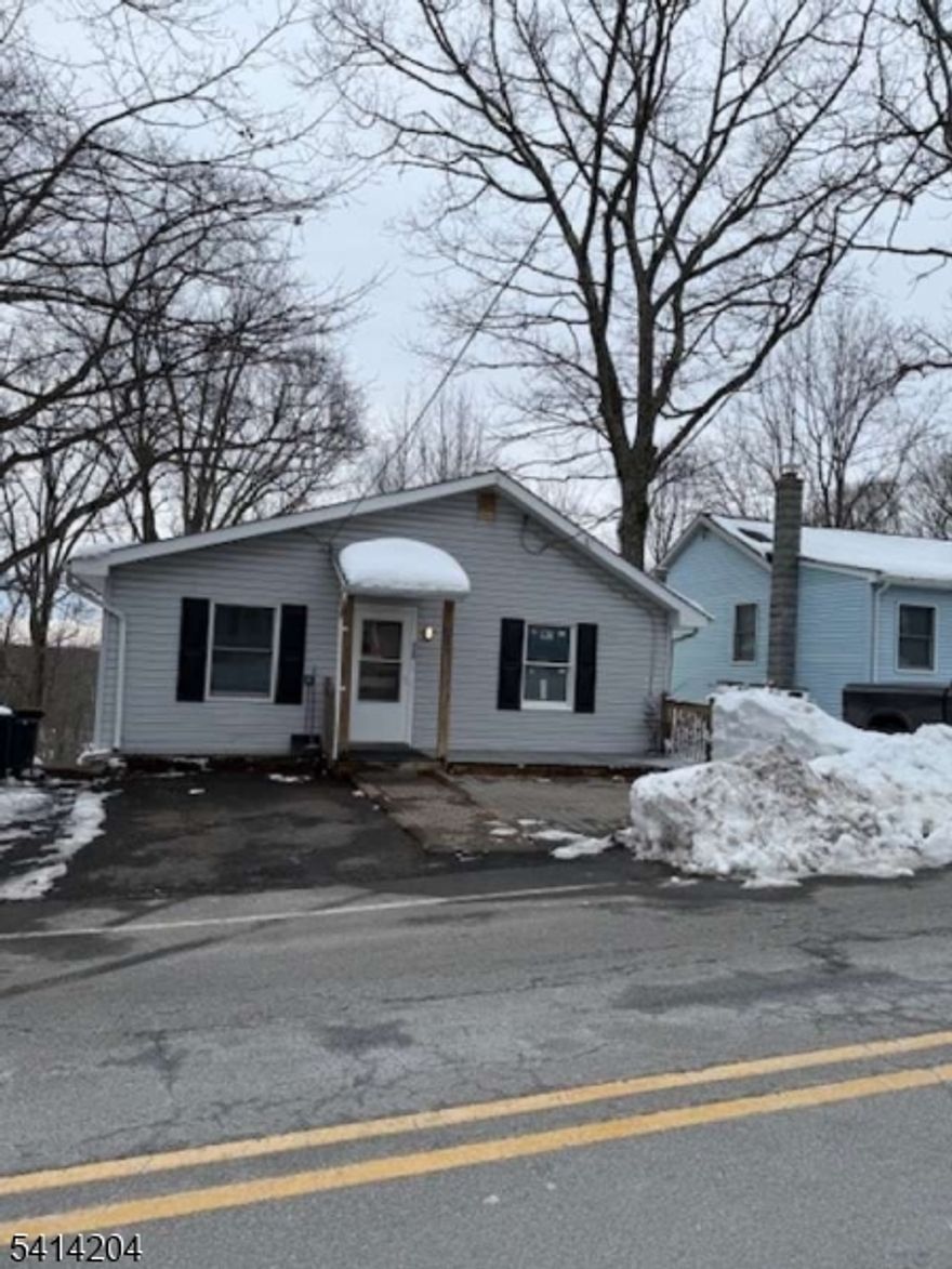 Don't miss out on this priced to sell quick, refreshed 3 - 4-bedroom home with 2 full bathrooms. This maintenance free home has scenic views overlooking the backyard and wooded area. Features a new eat-in-kitchen with plenty of new cabinets for storage, quartz countertops, and a ceramic backsplash. All new stainless-steel appliances including refrigerator, range, microwave, and dishwasher were added to complete this kitchen. This home has all top-of-the-line Anderson windows for energy savings. All floors are luxury vinyl plank or new carpet in the bedrooms. The laundry room is large enough for a full-size washer & dryer and folding area. The lower level is accessible from upstairs but also has its own entrance. It can be a primary bedroom with an en-suite or an in-law suite with its own full bathroom. Enjoy company under the large covered screened in enclosed deck, so no worries about rain here. You will enjoy ample closets and storage throughout. The large attic can also be used for storage. This home is heated with a newer boiler and a newer domestic hot water heater. This home is connected to public sewers Enjoy being close to public parks for picnics, hiking, swimming, laying on the beach, fishing, kayaking, and boating. Don't pass this one up, it's ready for its new owners.