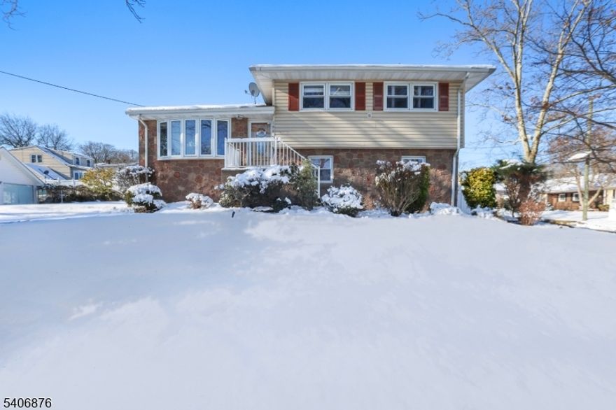 Welcome to 196 Russell Ave, a beautifully renovated split-level home nestled in the desirable Inman Heights section of Rahway, offering modern updates, flexible living space, and a prime corner-lot setting. This inviting home features three spacious bedrooms and two full bathrooms, including a primary bedroom with its own private bath, along with a bright and open living area perfect for everyday living and entertaining. The updated kitchen shines with stainless steel appliances and clean, contemporary finishes, while the fully finished basement provides valuable bonus space and includes a dedicated laundry room, ideal for a family room, recreation space, or home office. Additional highlights include a built-in garage, a wide driveway accommodating multiple vehicles, and a fenced-in yard offering privacy and outdoor enjoyment. Conveniently located near parks, schools, shopping, and transportation, this move-in-ready home combines comfort, style, and a sought-after location. Grab it before it's gone!