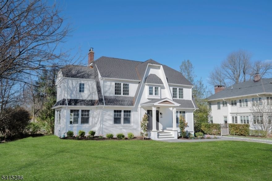 Luxury, Location, and Lifestyle: Welcome to 76 Woodland Ave.Perfectly poised in Summit's coveted Northside, this classic Colonial has been meticulously renovated and expanded for the modern connoisseur. Beyond the welcoming foyer, the home unfolds into a front-to-back LR and formal DR, where bespoke moldings set a tone of timeless elegance. At the heart of the home lies a chef's dream: a crisp white kitchen featuring quartz surfaces, high-end SS appliances, and a Sub-Zero frig. The expansive center island anchors the space, flowing seamlessly into a light-drenched FR defined by vaulted ceilings, a custom wet bar, and a cozy gas FP. For effortless in/outdoor living, sliding doors lead to a covered bluestone porch-the ultimate setting for alfresco entertaining and access to the flat, lush RY. The 2nd fl. is a dedicated sanctuary, headlined by a tranquil primary suite featuring a custom walk-in closet(s) and a spa-inspired bath clad in exquisite Carrara marble complete with heated Fls., an oversized glass shower, and a deep soaking tub. 3 additional generous BR's including 2 with en suites, share this level with a convenient, must have LR. Upstairs to the 3rd fl. offering 2 more BR and a full bath, providing a private retreat for guests.  An expansive LL is designed for versatility, featuring an oversized rec room, 2 flex leisure areas, and a PR. With an abundance of storage & a bonus rm perfect for a secondary laundry or a custom wine cellar, the possibilities are endless...
