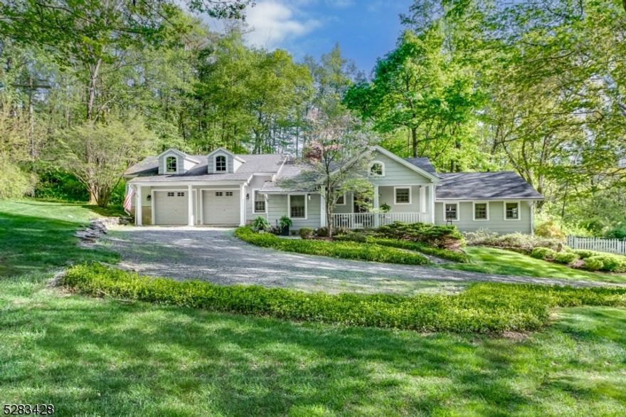 This picture perfect ranch-style home is timeless. The beautiful front porch with its slate flooring and chandelier is just the beginning of good things. The foyer, adorned with gleaming hardwood floors, sets the tone for the entire residence. To your left, the sunlit step-down living room awaits a cozy haven featuring a wood-burning fireplace with a stone surround. The vaulted beamed ceiling and strategically placed skylights infuse the space with warmth and character.The kitchen has a  breakfast bar, stainless steel appliances, built-in shelves, a farm sink and granite countertops plus plenty of storage. The kitchen seamlessly flows into the dining room with beamed ceilings and sliding glass doors which lead to the deck and incredible, private rear fenced yard. Retreat to the primary bedroom, boasting double closets and an en-suite master bathroom with a stall shower. Two additional bedrooms share a well-appointed main bath, complete with a linen closet and a tub-shower combo. Practicality meets style in the separate laundry room, which offers abundant storage.The finished lower level includes a family room with recessed lighting, an exercise room and Bilco doors leading to the backyard. There is an unfinished basement section, already plumbed for a bathroom, presenting exciting possibilities for customization. Additional features include central air and 2 car garage. LV Schools and WMC High School with IB Program.