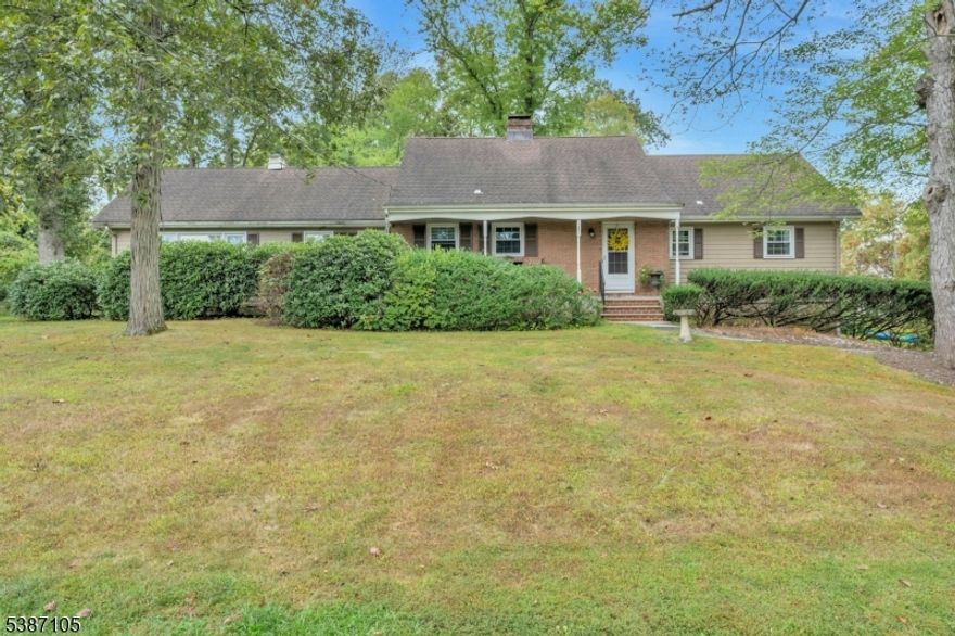 Large expanded ranch with large rooms, abundant closet space, open yard, front porch, 2 car garage, unfinished basement, patio & fireplace in living room.  Convenient location with easy access to trains, buses & highways.