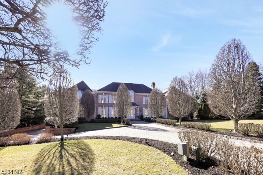 All Brick French Chateau nestled on 1 acre is located on tree-lined cul-de-sac.  The beautiful home was built by custom builders Commorata-Berardi and has exquisite detail with custom woodwork throughout.  First floor has a beautiful billiard room and library that leads to an open finished basement. The open finished basement features a movie theater with a concession stand and a gallery that would be perfect for a play area, a gym and/or a yoga studio.  The basement also has a full bathroom. The private  backyard is your own oasis with custom blue stone patios, a 300 square foot pool house consisting of a full bathroom, built-in grill, central AC and heating.  A 22 x 42 newly refurbished gunite pool is surrounded by manicured gardens and a pond.  Features of the home include a sonos sytesm, two back-up generators, five car garage and a newly updated alarm system.