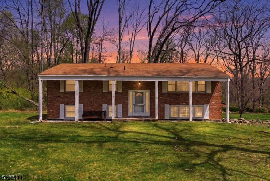 Bring your vision to this charming Bi-Level on over an acre in sought after Mt. Olive Twp.! This 3-bedroom, 1.5-bath bi-level offers generous living space on a beautiful acre-plus lot, a wonderful opportunity to make it your own. The classic bi-level layout provides a natural separation of living and sleeping spaces, and the oversized 2-car garage offers abundant storage and workspace that any homeowner will appreciate. The expansive lot provides plenty of room to enjoy the outdoors, entertain, or simply unwind in your own private setting, a rare find at this price point. Location is second to none. Just minutes from Budd Lake, New Jersey's largest natural lake, enjoy fishing, boating, and waterfront recreation year-round. Commuters will love the easy access to Routes 46, 80, and 206. Top-rated schools and nearby shopping and dining complete this fantastic package. Cash, renovation loans or conventional financing welcome. Sold strictly as-is. Don't miss this one!