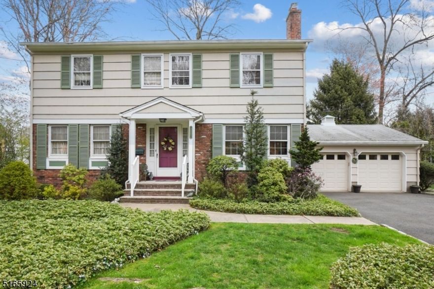 Your Cranford dream home is here! This charming center hall colonial is located on a quiet tree lined dead end street, located across from Nomahegan Park. Upon entering the foyer, you will immediately notice the oversized rooms & gorgeous hardwood floors. First floor family room is perfect for holidays with showpiece wood burning fireplace and wooden beams on ceilings. Large updated eat in kitchen features  granite countertops, custom cabinetry, and stainless steel appliances, overlooking scenic back yard. Convenient Laundry room and powder room located on first floor. Dining room with french doors lead to a large outdoor trex deck, perfect for summer BBQs, with mature landscaping and plenty of privacy! Four oversized bedrooms have abundant closet space with hardwood under carpet. Master bathroom and bedroom make perfect ensuite. Lots of storage throughout the home. MASSIVE 2 car garage. Great schools, convenient location. Lots of potential to truly make this home yours! Over 3000 sq ft of living space! Unbelievable price!