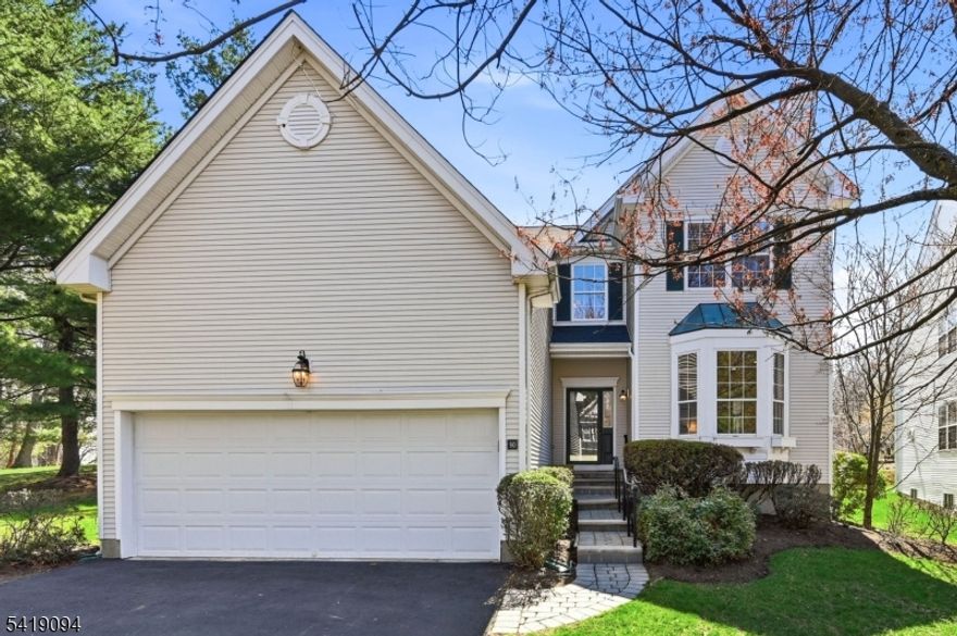 Welcome to this spacious 4 bedroom, 2.5 bath colonial style home set in desirable Reservoir Ridge. This home offers three finished levels of living space and a functional, flexible layout ideal for today's lifestyle. The main level features a brand new, completely renovated eat in kitchen with custom cabinetry, quartz countertops, and stainless appliances, along with a sunlit dining area and glass doors leading to the patio. The kitchen flows seamlessly into a bright great room with an abundance of windows and a wood burning fireplace, perfectly capturing the scenic backdrop. A spacious main floor primary suite offers a stunning new bathroom with a floating tub and step free shower. A formal living room with a second wood burning fireplace, dining room, laundry room, mudroom, and powder room complete the first level. Upstairs are three spacious bedrooms and another full bath. The home features new flooring throughout and has been professionally painted, creating a fresh, move in ready feel. The finished basement offers approximately 1000 sq ft of additional living space, a wet bar, and cedar closet, ideal for recreation, gym, or guests. Additional highlights include a two car garage, new roof, new HVAC, new HWH, and rare lift access from the garage to the main level. Ideally located with easy access to major highways, shopping, dining, and public transportation, this home is perfectly situated for today's commuter.