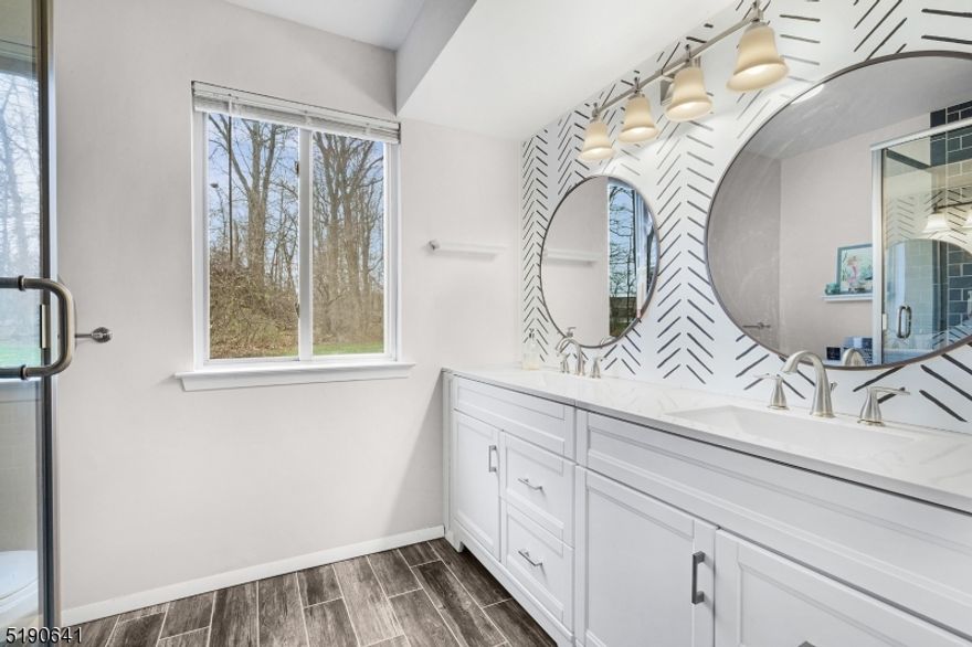 You must see this freshly painted one floor unit with spacious 2 bedrooms and 2 bathrooms on first floor. Living room, kitchen, and dining room offer open floor plan. Master bedroom features renovated master bathroom and walk in closet. Laundry room located in home plus 1 car garage for ample storage. Very convenient location: 1 minute to RTS 10, 46 & 80 nj/nyc transit as well as convenient to a variety of shopping mall.s Private location in the Drakesville neighborhood nestled in a parklike setting.