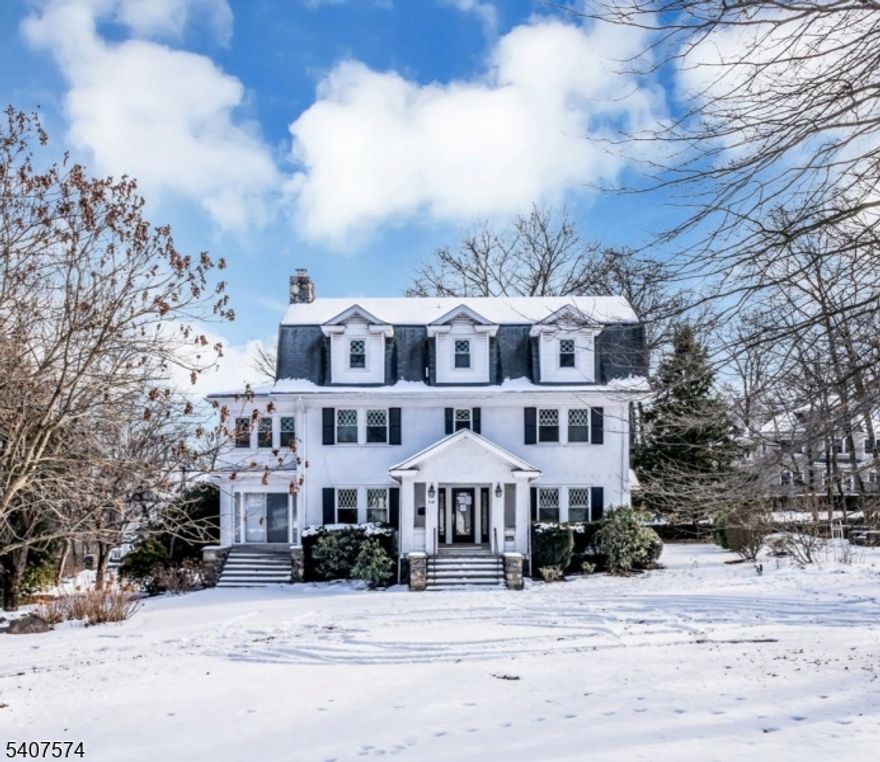 Set within the desirable  Mountain Lakes enclave, this distinguished 1913 Hapgood Craftsman is a rare offering that seamlessly blends architectural heritage with refined living. Gracefully sited in one of the town's most prestigious locations, the home is introduced by a circular driveway and framed by both a charming open front porch and an elegant wraparound enclosed porch, ideal for year round enjoyment.Inside, original craftsmanship takes center stage. Hardwood floors throughout, exposed wood beams, and thoughtfully preserved details create an atmosphere of understated luxury. The formal dining room, highlighted by parquet flooring and rich mill work, is perfectly suited for sophisticated entertaining, while the sun-filled living room offers a warm focal point with its classic fireplace and architectural depth.The residence features generously proportioned bedrooms, including a private primary suite complete with a walk-in closet and en-suite bath, offering comfort and retreat. A detached two-car garage complements the property's functionality without detracting from its stately presence.With nearby lake access, acclaimed local dining, and a convenient train station providing direct access to NYC, this exceptional home presents a rare opportunity to personalize a true Mountain Lakes classic an iconic residence awaiting its final, inspiredfinishing touches.