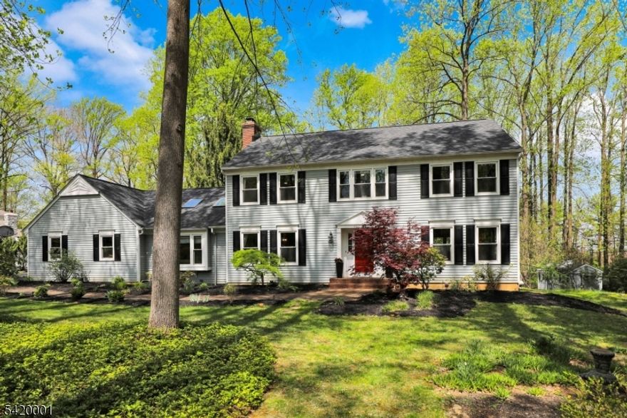 Set on a quiet cul-de-sac in The Summit, one of Basking Ridge's sought-after neighborhoods, this beautiful 4/5 bedroom, 3.1 bath center hall Colonial delivers the space, setting, and flexibility today's buyers are looking for. A light-filled foyer sets a warm and welcoming tone that carries throughout the home, where spacious rooms and a thoughtful layout create an easy, livable flow. The bright, updated eat-in kitchen features stainless steel appliances and a center island with granite countertops, and opens directly to a large deck overlooking a private, park-like yard. The main level offers bright, generously sized formal living and dining rooms, a convenient laundry room, and a stunning two-story family room with skylights and a wood-burning brick fireplace, creating a warm, inviting focal point. A versatile additional room with an adjacent full bath provides the ideal space for a home office, guest suite, or flexible living. Upstairs, there are four spacious bedrooms and two full baths, including a primary suite complete with two walk-in closets and a beautifully updated, spa-like bath featuring a frameless glass shower. The finished lower level further expands the living area with a bar or kitchenette, rec room, playroom and game room"flexible space to suit buyers' needs. Conveniently located with easy access to nationally ranked schools, shopping, NJ transit train and major commuter routes. New roof (2026). Most rooms have hardwood flooring.