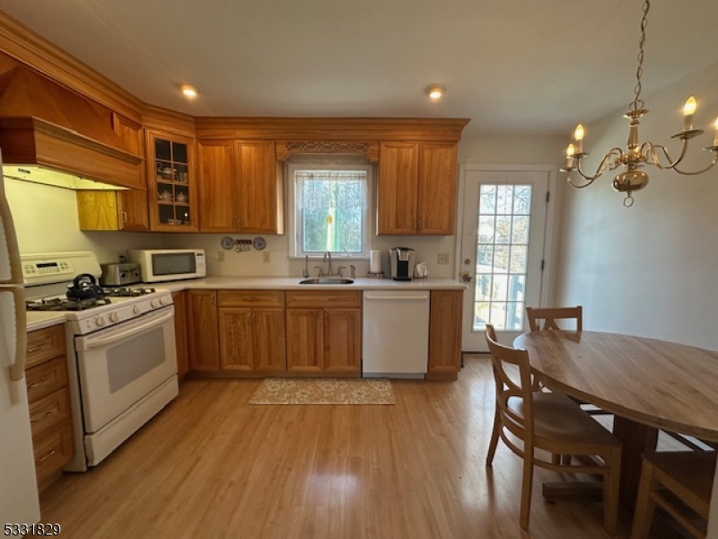 Charming Cape Cod w/ 4 Bedrm & 2 Full Baths - Solar Panels Included & Fully Paid - (Owner elec bill typically has a credit monthly)  Updated Eat in Kitchen - Good Size Living Rm and 1st flr Master - Spacious Basement - 2nd Flr has Master w/ Full Bath & 2nd Bedrm - 1st Flr has Hardwood Under Carpet - Gas Heat - Deck off Kitchen - Quiet Street - Great Starter Home - MOVE IN READY!!