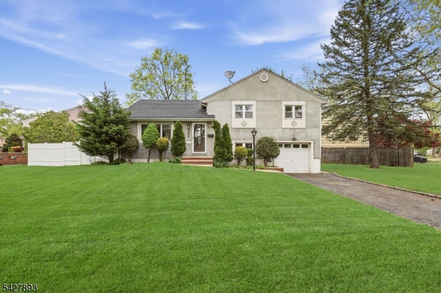 Welcome to 721 Beechwood Rd, a beautiful split-level home offering modern updates, comfortable living space, and a functional layout in Sunnyside Linden. This inviting home features three spacious bedrooms, one full bathroom, and one half bathroom, along with a bright living room, a formal dining room, and a well-designed kitchen with a separate dining area equipped with updated stainless steel appliances and clean contemporary finishes. The layout provides a natural flow ideal for everyday living and entertaining. A finished basement adds valuable bonus space, perfect for a family room, recreation area, or home office, while a walk-up attic offers additional storage potential. Additional highlights include an attached one-car garage, a private yard with a patio, and a fenced exterior for added privacy. With its thoughtful updates and versatile layout, this move-in-ready home is a fantastic opportunity. Grab it before it's gone!