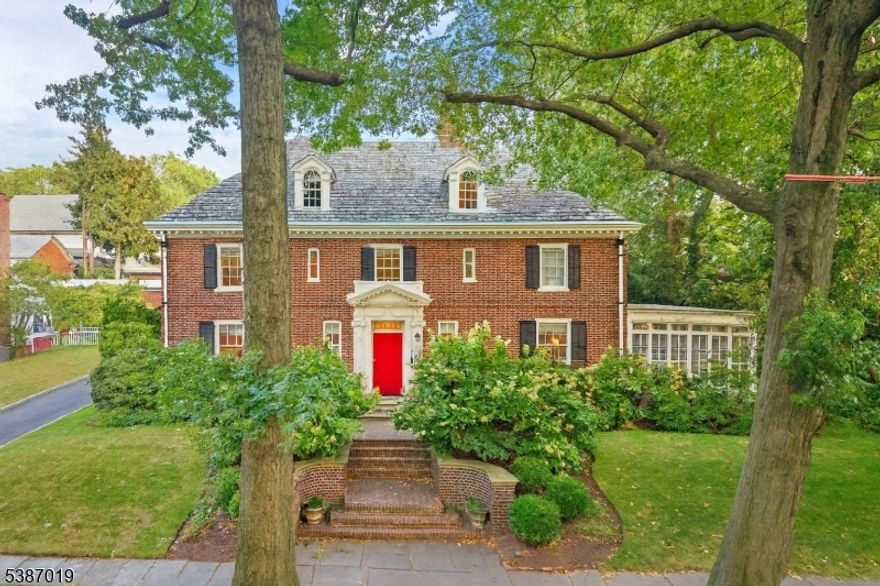 Welcome to this spectacular 5,000 sq. ft. Historic Landmark residence in Newark's sought-after Forest Hill. Featured in House Beautiful, and restored by renowned designer Sasha Bikoff, this home seamlessly combines classic architecture with modern design across three expansive floors of living space. A stunning entrance hall sets the stage for elegant entertaining, while a large solarium, off the living room, fills the home with natural light. The chef's kitchen impresses with Miele appliances, a Blue Star range, steam oven, and Gaggenau refrigerator/freezer units. The thoughtful design continues with California Closets throughout, a powder room on the first floor, updated bathrooms, and a jaw dropping primary suite with walk-in closet, soaking tub, and steam shower. High-end upgrades include a Sonos in-ceiling sound system, custom brass sinks, Toto smart toilets, two fireplaces, and commercial-grade WiFi. Outdoors, enjoy private patios, a secluded backyard with lush landscaping and hydrangeas, and a custom sound system for gatherings. For quiet moments, retreat to the second-floor deck off the office/bedroom perfect for morning coffee or an evening cocktail. Across from Branch Brook Park and its iconic cherry blossoms, and just 40 minutes to NYC, this one-of-a-kind home offers elegance, comfort, and space to truly spread out.