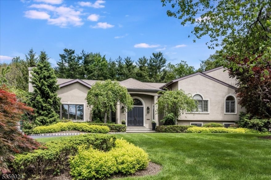 Your search for the perfect home with an exceptional in-law suite ends here. This Chestnut Hill showpiece offers a full floor dedicated to private guest quarters complete with two bedrooms, a full bath, a second kitchen, and a family room. Beyond the suite, enjoy a putting green, resort-style pool, and four levels of thoughtfully designed living space that deliver surprises at every turn. Step into an expansive foyer framed by a graceful archway opening to grand living and dining rooms. Soaring ceilings and two sets of French doors create a stunning backdrop for entertaining, while natural light floods the home from every angle. The updated kitchen anchors the heart of the home with premium appliances and custom design. A vaulted family room connects seamlessly to the kitchen and breakfast area, while a tucked-away office off the kitchen provides a quiet workspace. Upstairs, the primary suite features French doors to a private terrace, dual walk-in closets, and a spa-like marble bath. Four additional bedrooms and two Jack-and-Jill baths complete the second floor. The third floor offers a bright flex space perfect for play, practice, or Pilates. The lower-level entertainment area is a showstopper, BOAsting a custom wet bar that makes it the ultimate setting for parties or casual gatherings. The backyard is an oasis, featuring a heated in-ground pool, multiple stone patio areas for lounging and dining, and a lush, level lawn surrounded by mature trees for complete privacy.