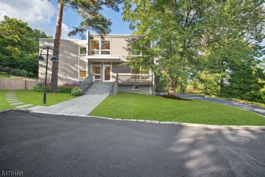 Iconic Contemporary home on a large lot features an Entrance Hall, expansive glass and eat-in Kitchen with island, Breakfast Area, fireplace and adjacent walk-in pantry and Powder Room.  The spectacular Great Room has a soaring ceiling, floor to ceiling windows and wood burning fireplace.  The home includes a formal Dining Room that opens onto the rear deck/patio, a Family Room with built-ins and sliding glass doors, a Den, a private Office also with built-ins (perfect work from home space), and a Powder Room.  Upstairs, the staircase is lighted by a central skylight.  The bedroom areas contain a large Primary Suite with Primary Bathroom, 3 additional Bedrooms and 2 more Bathrooms.  There is also a Bathroom in the basement.  The property includes an in ground pool with spacious decking, and extensive front and rear yards.  Situated on Upper Mountain Avenue between Watchung Plaza and Upper Montclair Village, close to Midtown Direct trains and Edgemont and Anderson Parks.