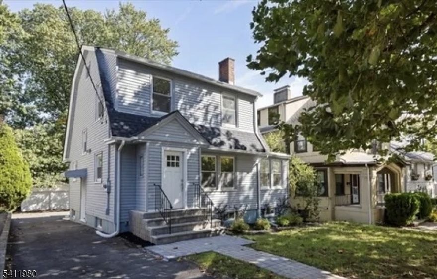 Welcome to this beautifully updated Dutch Colonial style home located in the disable Seven Oaks section of Orange, NJ, offering space, comfort, and versatility across three finished levels. The first floor features a bright living room with a fireplace, formal dining room, updated kitchen, dedicated office, full bathroom, washer and dryer, and a convenient first floor bedroom ideal for guests or flexible living. A functional mudroom provides easy access to the outdoors and leads to a full deck, perfect for entertaining or relaxing. The second floor offers three generously sized bedrooms and a full bathroom, providing ample space. The fully finished basement adds even more living space and includes a full bathroom, making it ideal for a recreation room, home gym, or additional living area. This home has been thoughtfully updated throughout and also includes a private driveway and detached garage. A move-in-ready property offering classic charm with modern updates and exceptional functionality.