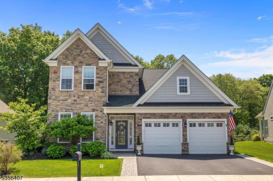 Completely upgraded Bronson Country Manor model in special rare location backing to woods, in the desirable Regency at Flanders 55+ community! A two story foyer welcomes you with engineered hardwood flooring. There's a guest room / study on the first floor along with conveniently located laundry room and entry to oversized 2 car garage with openers. Open concept living space includes 2 story living room, formal dining room area with tray ceiling and gourmet white kitchen with quartz countertops, higher end stainless steel appliances, as well as custom mirrored tile backsplash. Spacious primary suite features bedroom with tray ceiling, walk-in closet, double closet and luxurious bathroom with double vanity, walk-in shower with bench. Second floor offers a 3rd bedroom, full bath with tub shower and loft area, open to family room below. Gorgeous views of surrounding mountains from private paver patio surrounded by blooming hydrangeas and stone retaining walls, covered porch area, outdoor kitchen with Weber grill, custom landscaping, and more! Other custom upgrades include automatic generator, alarm system, irrigation system, extensive custom moldings, 9' ceilings and so much more. Community amenities include pool, club house, fitness center, sport courts and miles of sidewalks. Flanders Valley Golf Course is across the street from Regency. Wrought iron patio furniture remains.