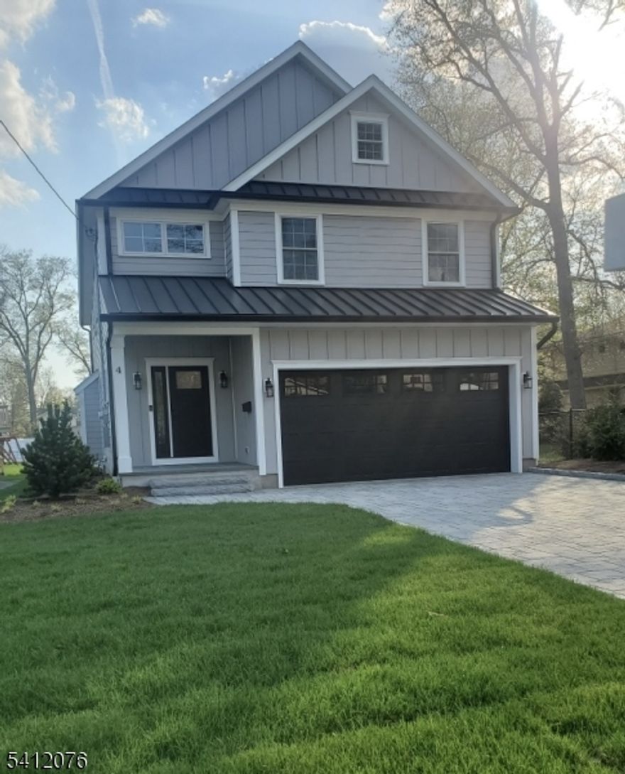 This stunning newly constructed home (with builders' 10 year warranty boasts meticulous attention to detail throughout. 6 Spacious Bedrooms, 5 full & 1 half Baths. First floor boasts open concept Living/Dining Room with gas fireplace & sliding doors to huge deck with gas hook-ups for outdoor entertaining. 2-zone heating & cooling. Beautifully appointed Kitchen with all stainless steel appliances including wine refrigerator, granite countertops, spacious center inland & detailed lighted cabinets. First floor guest Bedroom or Office including full Bath, Mudroom, & Powder Room complete this level. 2nd floor offers 4 luxurious Bedrooms & 3 full Baths plus Laundry Room. Primary Bedroom with vaulted ceiling; ceiling fan & stunning backsplash; fully appointed walk-in closet. Primary Bath has heated flooring & dual sinks. Lower level provides versatile living with access to backyard. Bedroom with full Bath plus storage area. This home truly maximizes comfort & functionality. Extras include: underground irrigation system, electric charging station conveniently located in the spacious 2-car garage, gutter guards, paver driveway with parking for 4 cars. Newly landscaped on deep lot. Taxes to be assessed.  Some photos noted have been virtually staged.