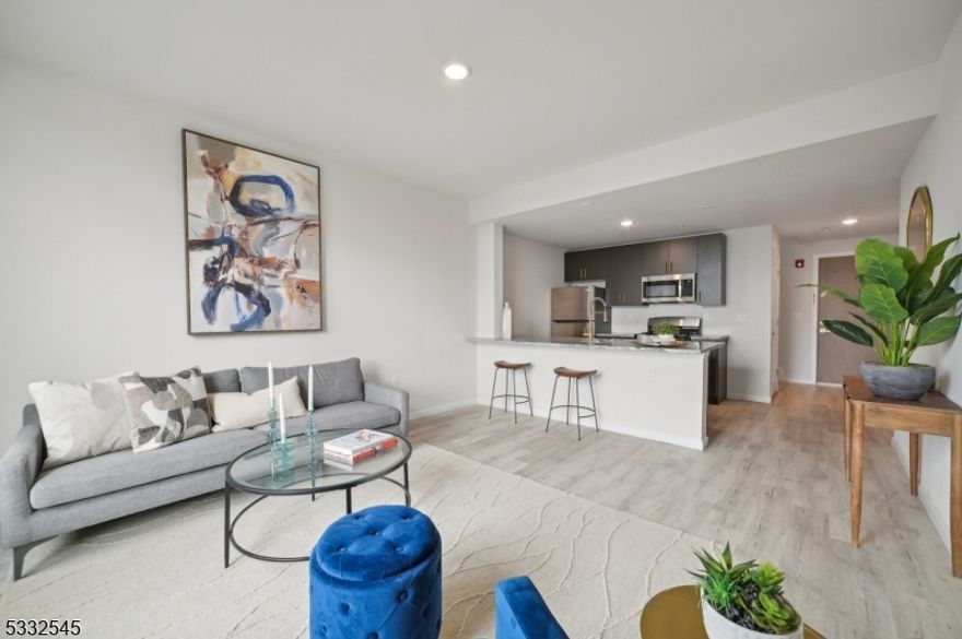 Welcome to The Modern, a luxurious Rental building in East Orange,NJ. This stylish 1-bed, 2-bath plus den loft offers a perfect blend of convenience and luxury. The kitchen features ample cabinetry, stainless steel appliances, and granite countertops,The spacious bedroom offers a peaceful retreat with a large closet perfect for storage. Travel upstairs, to discover a generous den, ideal for an office space or even large enough to serve as a second bedroom. This level also features a second full bath and grants access to a private rooftop terrace. Sunlight floods through large windows, brightening the modern design and creating a serene urban retreat. With in-unit laundry, this apartment redefines city living by seamlessly combining style and convenience in the heart of East Orange.The Modern stands 5 stories tall, offering 119 residential units, including studios, one-, and two-bedroom layouts.All units feature contemporary finishes, stainless steel appliances, in-unit washers and dryers, and large windows with city views.Residents enjoy premium amenities, including a fitness center,rooftop lounge, and community room. The building's prime location offers easy access to major highways and public transportation,providing a quick commute to New York City and surrounding areas.Nearby, you'll find an array of dining, shopping, entertainment options, and several parks and green spaces for outdoor enjoyment.PARKING AVAILABLE AT ADDITIONAL COST - PHOTOS ARE OF SIMILAR UNIT