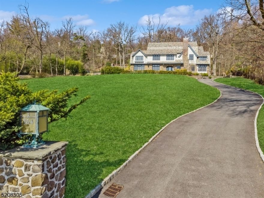 This stunning one-of-a-kind home is a perfect blend of preserved period details and contemporary finishes, creating a gracious atmosphere for entertaining & intimate gatherings alike. Enjoy breathtaking skyline views all year round. Conveniently located near Up Mtc shopping, restaurants & transportation. Period details in this home are truly impressive, with leaded glass windows, coffered ceilings, crafted millwork, wainscoting, wood-panelled dining room & gleaming hardwood flrs. But the improvements are equally impressive, including new BAs, kitchen & radiant heated floors in the solarium, kitchen, powder & 2nd flr BRs. Kitchen is a home chef's dream, featuring high-end appliances like the LA Cornue 6-burner range with pot filler, SubZero fridge, wine cooler, leathered marble ctr island with hammered prep sink  plus farm sink. The kitchen also has a walk-in pantry & is flanked by a breakfast area & home office. The expansive primary suite is a luxurious retreat, with 2 sitting areas, 2 WIC & a spa-like BA with soaking tub, stall shower, dual vanities & separate commode. Laundry & 3 add'l ensuite BRs & roof deck, complete this level. 3rd level offers 2 large BRs, a sitting rm & full bath. Above the garage is a great room with a vaulted ceiling, loft & full bath, perfect for guests. The LL has a rec space plus tons of storage. Enjoy the  skyline views from the expansive blue stone patio.  Simply unpack your bags and move in! Property assessment 2024 tax book is $1,785,900.