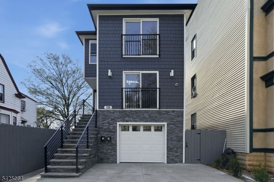 Discover an unparalleled opportunity in this New construction 2 family masterpiece, boasting over 6,500 sqft of total living space. Set on an extraordinary 25' x 223' lot, this property combines massive scale with modern luxury. Each of the two main units offer over 2200 sqft of sprawling layout featuring 4 spacious bedrooms and 2 full bathrooms, including a grand primary suite with an oversized walk-in closet.The heart of each unit is a stunning open-concept kitchen designed for the modern chef. The space is remarkably airy and wide, centered around a large island that flows effortlessly into the living and dining areas, making it perfect for hosting large gatherings. For ultimate convenience, dedicated laundry rooms are located on both the first and second floors.The ground level provides an additional 2,000+ sqft of expansive open space, complete with a half bathroom. This versatile area offers endless possibilities for a home gym, media center, or a space for extended stay visitors. The opportunities are endless. The highlights continue outdoors with a backyard stretching over 100 feet deep a rare private sanctuary that invites your imagination, whether you envision a professional landscape, a playground, or an outdoor kitchen. With a total of 8 bedrooms and 5 bathrooms, this high-yield asset is built to the highest standards with premium finishes throughout. Don't miss your chance to own one of the largest and most versatile new constructions ever built in East Orange.