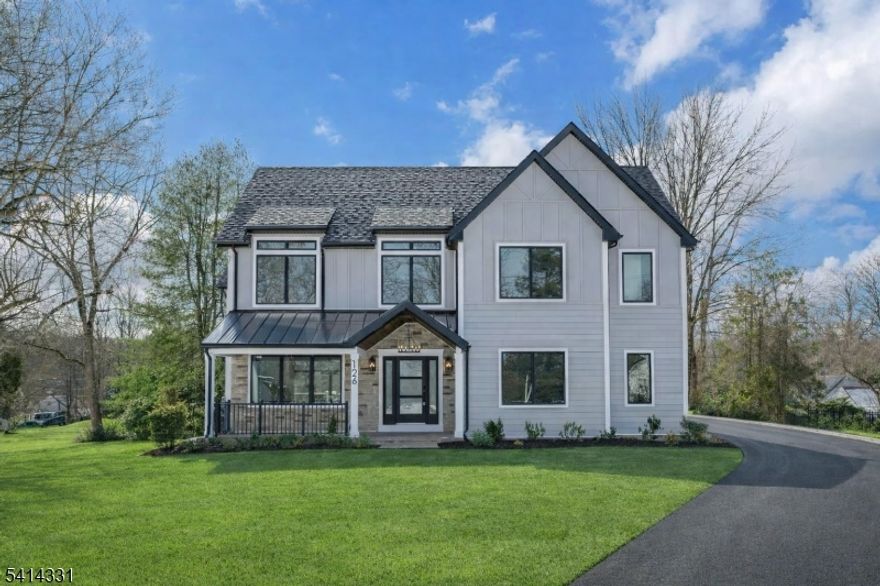 Welcome to 126 Emerson Lane. This 5-bedroom, 6.5-bath custom home offers an open-concept floor plan, premium designer finishes, and high-end craftsmanship throughout.The first floor features a gourmet chef's kitchen with oversized island that flows seamlessly to the dining and family rooms.  The family room opens to a deck overlooking the expansive, level backyard offering endless potential and seamless indoor-outdoor living. The main level also includes a private first-floor office, walk in pantry, laundry room, a sitting room, powder room and a first-floor bedroom with en-suite bath and walk-in closet. The second floor features a luxurious king-sized primary suite with vaulted ceilings, gas fireplace, dual walk-in closets, dedicated outdoor space perfect for morning coffee, and a spa bath with his-and-her sinks and soaking tub. Three additional bedrooms complete this level two with en-suite baths and one served by a hall bath all with generous walk-in closets.The finished lower level includes a mudroom directly off the garage entrance, a spacious recreation room, full bath, and flexible bonus space ideal for a media room, office, or gym. With the addition of a closet and zoning approval, the space offers potential for a sixth bedroom. A dedicated exterior door provides egress, creating a true walkout basement. A two-car attached garage and expanded driveway complete this exceptional home. Close to top-rated schools, shopping, and NYC transportation.