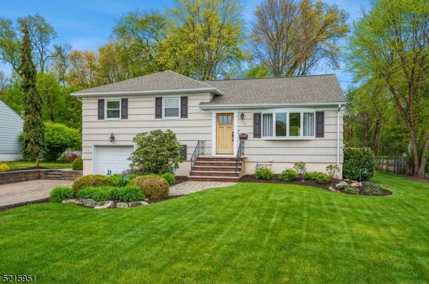 Stylishly renovated charmer! Beautifully updated and maintained Split Level home is immaculate and full of upgrades! Offering three bedrooms, two full bathrooms, and an attached one-car garage, this home has a great open layout with shining hardwood floors, crown molding, and a soothing neutral d cor. The living and entertaining spaces flow outside to a large deck overlooking a meandering patio and beautiful back yard with a garden storage shed bordered by woods beyond for peaceful privacy. An extra-wide stone paver driveway and walkway bring you inside to a large, sunlit living room, a formal dining area, and a sleek updated kitchen with granite counters, crisp white cabinets, stainless steel appliances, and a breakfast bar. Sliding glass doors bring in lots of natural light and open to the inviting deck overlooking the private backyard perfect for gatherings, gardening, and relaxing. The upper level includes the primary bedroom, two additional bedrooms, and a full updated bathroom. On the lower level offers great space with a comfortable family room, a full updated bathroom, a laundry room with access to the attached garage, and an additional access to the back yard. Nestled in a quiet neighborhood with utmost privacy and conveniently located  close to shops, restaurants, I-280 and Rt 10.