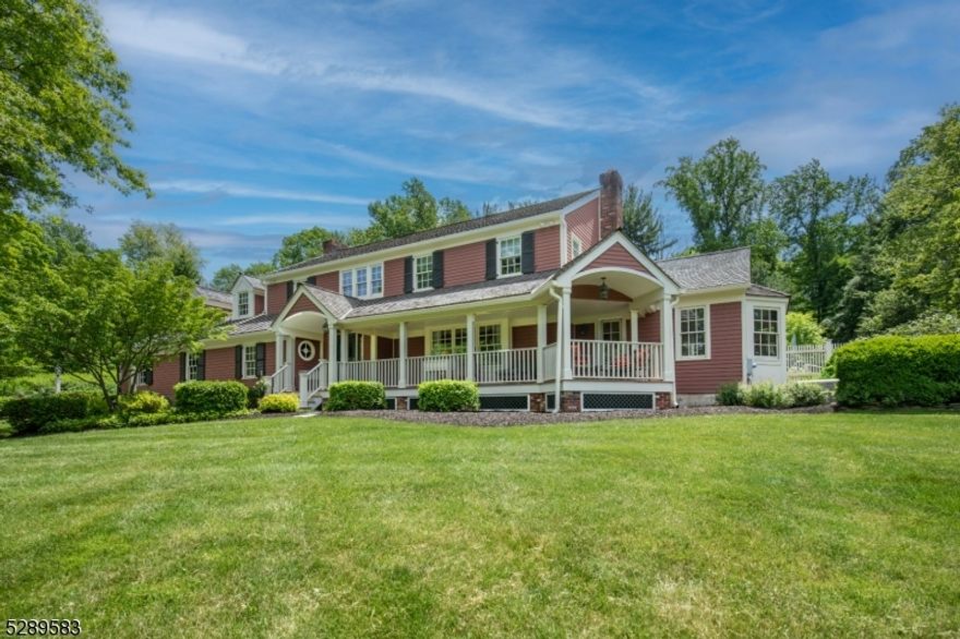 A wonderful custom home renovated in 2019 and situated in a sought-after Bernardsville neighborhood. The updated large center island kitchen and stylish baths are modern, on-trend and filled with upscale amenities.  Classic design elements such as hardwood floors, architectural details, three fireplaces, a custom built wet bar, built -in speakers, and extensive moldings, wainscoting and woodworking throughout the home. This home has a wonderful front porch with mahogany floors  and access from the library and front door as well as access to the backyard patio with doors from each room to a beautifully landscaped backyard with  a unique granite coping pool and hot tub designed to be hidden from the ground level. Magnificent home for entertaining.