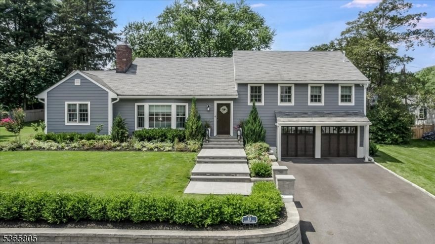 Welcome to 43 Woodmont Road in Upper Montclair a showstopping, top-to-bottom renovation on nearly half an acre, just four houses from Yantacaw Park and a short stroll to Brookdale and Tuers Parks. Every inch of this home has been upgraded with intention and high-end design, inside and out there's truly nothing to do but move in and enjoy this spectacular home in a prime location. The kitchen is a chef's dream with quartz waterfall island, farm sink, and high-end stainless appliances overlooking a beautifully landscaped, fenced backyard retreat. Entertain in style with a Trex deck with retractable canopy and lighting, paver patio with gas fire pit, outdoor kitchen with built-in BBQ and fridge, plus a Sport Court basketball court. The full interior renovation includes the kitchen, bathrooms, designer lighting and wallpaper, custom closets, Smart Home features with Nest controls, and a gas fireplace. Two bedrooms feature en-suite baths, and the layout offers both open flow and cozy spaces. All new Andersen windows, doors, Everlast siding, and bluestone walkways. Finished garage with epoxy floors, new garage doors with built-in cameras. Generator, new 2-zone HVAC, full security system, irrigation, and new sewer line round out this fully turn-key home in an unbeatable location just minutes to NYC train, bus, parks, and vibrant Uptown Montclair.