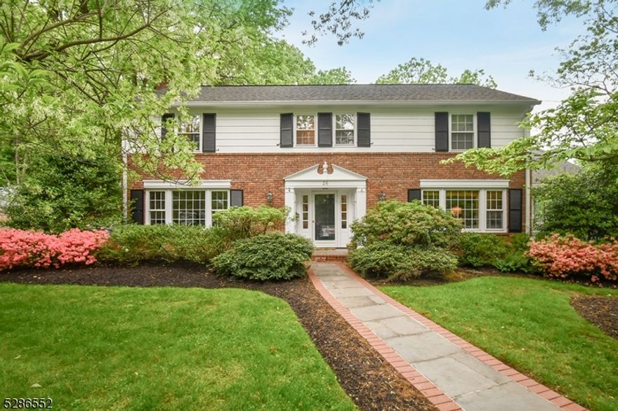 Classic Woodland Park Colonial in fantastic neighborhood just steps to Franklin elementary school.  Generous room sizes, home office, front to back living room, eat in kitchen open to family room and spacious bedrooms as well.  Recently refinished hardwood floors and abundant built ins and architectural detail.  Convenient attached oversize 2 car garage.  Walk out lower level with recreation room, exercise area, full bath, laundry and storage.  Lovely private rear yard and bluestone patios with natural gas grill.  Well maintained with 2 zone CAC, 4 zone heat with 2022 new high efficiency boiler, 2022 new hot water heater, newer front walk way and patio, 2023 exterior paint.  Prime location and Prime living!