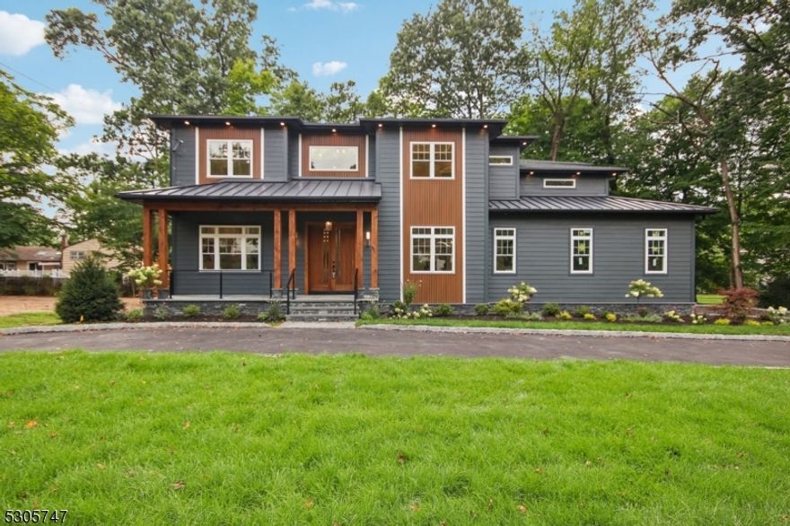 Experience unparalleled uniqueness in this new construction home, setting a new standard with its modern fixtures, stylish finishes, and exceptional amenities. Spanning 5,296 sqft, this meticulously designed residence features a soundproof movie theater and a wine cellar, perfect for entertainment. This east facing home offers 6 bedrooms and 5.5 bathrooms, including a master suite with a private balcony, his-and-hers closets, a freestanding tub, a spacious standing shower, and a double vanity. The expansive kitchen boasts quartz countertops, Wolf and Viking appliances, a butler's pantry, a mudroom, and much more. As you approach, step through the custom solid mahogany door to discover a home with high ceilings, a modern hanging chandelier, and hardwood floors throughout. The stairs and ceilings feature a stunning LED design, with sensor-activated lights illuminating each step as you walk. The second floor features a phenomenal layout with 4 bedrooms and 3 full bathrooms, including 2 bedrooms with their own private bathrooms and 2 bedrooms connected by a Jack and Jill bathroom. The home exudes luxury with a circular driveway accommodating over 5 cars, complemented by 2-car garages. This home truly has it all!