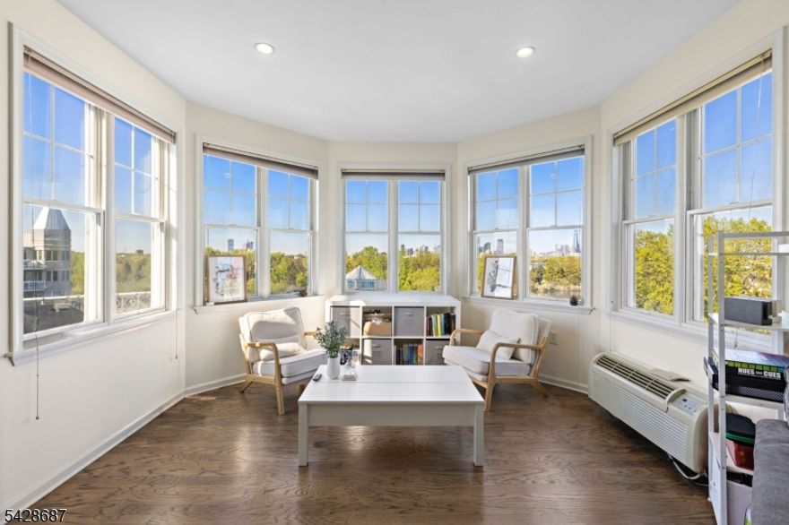 Residence 404 at 15 Freedom Way is a 1510 SF 2 bedroom 2 bathroom top-floor condo with directly NYC views. This sun drenched corner unit offers an open floorplan and balcony overlooking many of the Port Liberte amenities as well as the Manhattan skyline. The eat-in kitchen has an abundance of storage, stainless appliances and granite countertops. The primary bedroom is complete with walk-in-closet, ensuite with double sinks, frameless shower and separate soaking tub. Residence 404 is further enhanced with in-unit laundry and 2 garage parking spaces. Port Liberte is an amenity-rich waterfront community situated between Liberty National Golf Club and the Hudson River offering residents the option to rent or own a deep-water slip for seasonal docking of sailboats, powerboats, jet skis and kayaks. Community amenities include 2 pools, tennis and basketball courts, 4600SF fitness center with saunas, locker rooms and massage room, as well as a clubhouse and dog park. Monthly maintenance includes water, hot water, parking, daily trash removal, snow removal, 24-7 gated security and use of all Port Liberte amenities. Additional on-site conveniences include a NY Waterway Ferry terminal with service to lower Manhattan, and shuttle bus to the Grove Street PATH Station which services both 33rd Street and World Trade Center, Growing Seeds Learning Academy, Smile Dental Studio, Felina Steak restaurant and Stork Club Rooftop.