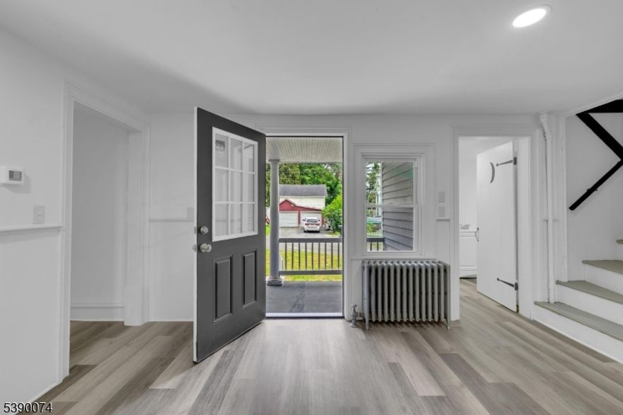 COMPLETELY renovated colonial home with a rocking chair front porch, perfect for relaxing and enjoying the neighborhood. This home features 3 bedrooms, 2 full bathrooms, NEW SS appliances in the kitchen, NEW cabinets and counter tops., a large laundry room with a folding counter, and new laminate flooring throughout the house. There is an additional room that could be a playroom, office, den, or whatever you desire. New furnace, NEW water heater, NEW septic installed in 2025. Almost all of the windows are new. This home is minutes away from the Poconos, hiking trails in the Delaware Water Gap National Recreation Area and has quick access to Route 80, 46 and 31. Columbia offers the serenity of small-town living, surrounded by natural beauty, outdoor adventure, and historical charm. A wonderful chance to make this home your own in a charming small-town atmosphere located in the Delaware Village Historic District.