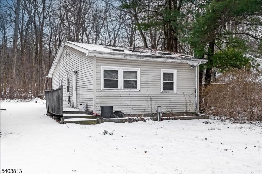 Affordable Opportunity with Lake Views!Small ranch-style home offering approximately 666 square feet of living space with 2 bedrooms and 1 full bath. The property sits on a flat lot with lake views, providing great potential for the right buyer. Home is strictly sold in, "as is" condition.The home is in need of repairs and updates and is priced accordingly, making it an excellent opportunity for investors, contractors, or buyers looking to create their own dream home. Seller will not deliver the property in broom-swept condition and may leave any and all personal property at the residence.Buyer is responsible for all town and state requirements. With some vision and effort, this property could be transformed into a charming retreat or year-round residence. Along with paid membership, enjoy access to Cozy Lake, featuring a beach for swimming and on-the-water activities like boating, paddle-boarding, and fishing.Bring your ideas and make this affordable home your own!