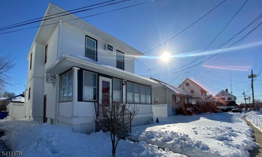 This 3-bedroom Colonial offers a practical layout and multiple bonus spaces that add flexibility. The first floor includes a living room, formal dining room, kitchen, and a convenient powder room, along with enclosed front and rear sunrooms that can serve as sitting areas, work space, or hobby rooms. A deck overlooks the fenced backyard, providing privacy and usable outdoor space.Upstairs are three bedrooms and a full bath, plus a pull-down attic for additional storage. Hardwood floors run through the living room, dining room, hallway, and bedrooms.The unfinished basement includes a laundry area, utility sink, and an additional toilet, with ample storage space. Appliances are included in as-is condition with no known issues.