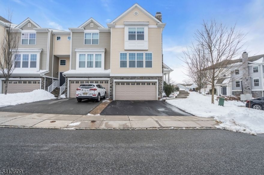 Welcome to 18 Blazingstar Way   a luxury end-unit townhouse nestled in the sought-after gated community of Panther Valley in Hackettstown, NJ. Built in 2014 and thoughtfully upgraded throughout, this stunning 3-bedroom, 2.5-bath home blends modern elegance with everyday comfort. Step inside to discover solid wood flooring and a spectacular custom kitchen completed just four months ago, featuring quartz countertops, premium appliances from Sub-Zero and Bosch, reverse osmosis water filtration, and a garbage disposal. The entire home is fully integrated as a smart home. Enjoy seamless indoor-outdoor living with a retractable backyard awning and breathtaking mountain views. Additional highlights include custom shades in every room, a fully finished basement for expanded living space, and an epoxy-coated two-car garage with ample guest parking nearby. Residents of Panther Valley enjoy 24-hour security along with resort-style amenities including pools, tennis courts, playgrounds, walking trails, and a dog park. Convenient access to major highways makes commuting simple while still enjoying a peaceful, scenic setting.