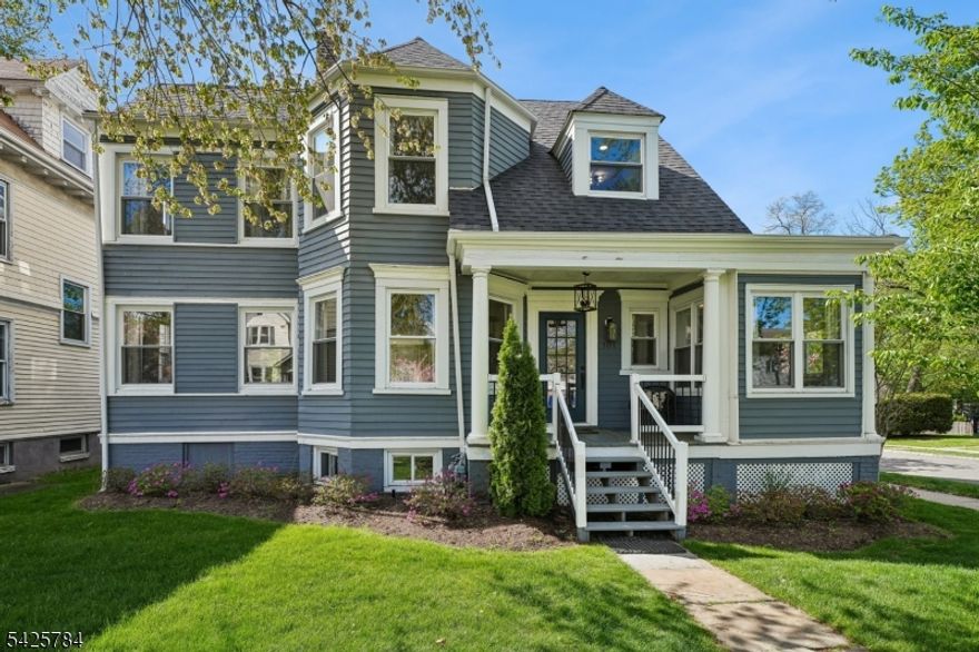Don't miss this beautiful 5-bed/3.2 bath Colonial located in the heart of South Orange's fabulous, tree-lined Seton Village neighborhood. Great walkable location close to lively South Orange Village with restaurants, shops, library, Baird rec center, parks, town pool and trains to NYC/Hoboken. This turnkey home has been fully updated from top to bottom. Welcoming front porch leads you in to the first floor with great flow for entertaining, opening to the spacious and light-filled living room, open to the dining room with updated kitchen with center island. The adjacent family room with fireplace provides space for relaxation or play. The sunroom offers the ideal home office space. This floor also includes a convenient and updated powder room. The second floor includes a spacious primary suite with large walk-in closet and stunning full bath with soaking tub. Your very own private retreat! There are two additional bedrooms -- both offering lots of light -- plus an updated full hall bath and convenient second floor laundry. The third floor provides an additional two bedrooms, full bath, and plenty of storage. Large basement includes a rec room, half bath, storage, plus walkout to the backyard with detached 2-car garage. Don't miss this must-see gem!