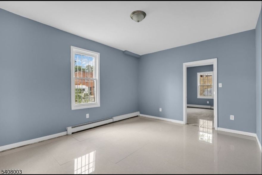 This 2-bedroom, 1-bath unit offers a functional layout with a bright living area, an eat-in kitchen with ample cabinet storage, and well-sized bedrooms with natural light. The bathroom includes tile finishes and standard fixtures. Conveniently located near NJ Transit bus lines, the Garden State Parkway, local schools, shopping, and parks, providing easy access to Newark and NYC commuter routes.