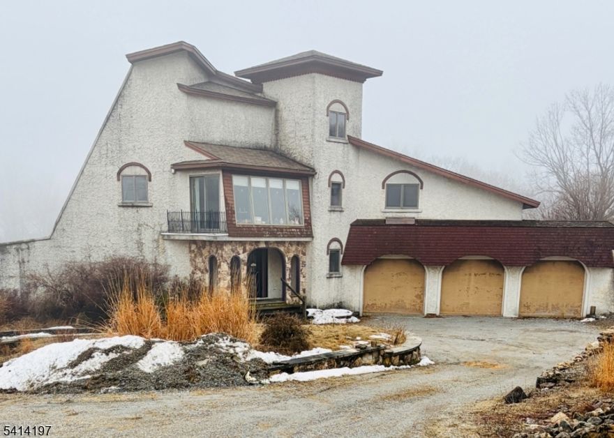 Custom Home Opportunity on 8.72 private wooded acres. Set on a breathtaking property with expansive mountain and skyline views, this partially completed custom home is ready for its next chapter. The 8.72- acre parcel offers exceptional privacy, natural beauty and endless potential to bring your vision to life. The interior features generous living space with four bedrooms, three of which offer walk- in closets for ample storage and comfort. A new refrigerator and updated dishwasher are already in place, adding value as you complete the home to your taste and style. Whether you're looking to create a private retreat or a one-of-a-kind custom residence surrounded by nature, this property presents a rare opportunity to finish and personalize a home in a truly remarkable setting.