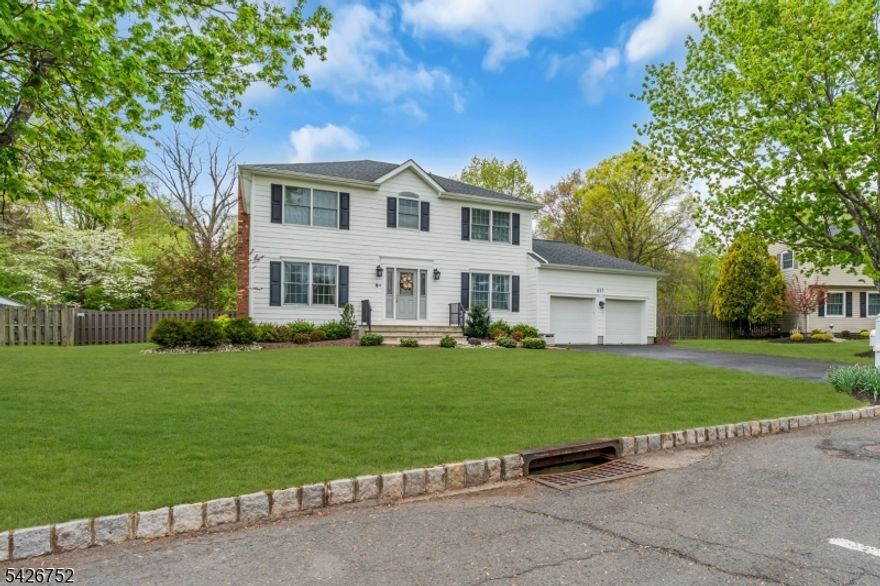 Beautifully maintained 4BR Colonial, thoughtfully remodeled in 2005. The heart of the home is the expanded and updated kitchen, designed with both function and style in mind. The adjoining breakfast room includes a built-in bench perfect for casual meals. The Kitchen boasts a Thermador stove and gas cooktop, Viking hood and microwave. A KitchenAid refrigerator and DW, a Sub Zero bar refrigerator is tucked into a well-appointed butler's pantry with an additional pantry closet. The inviting FR is warm and welcoming with a gas fireplace, and a surround sound system for an enhanced entertainment experience. (Receiver may be included). A full finished walkout basement provides valuable additional living space, ideal for a recreation area, home office, or guest accommodations. Step outside to a fenced-in backyard featuring a low-maintenance composite deck that backs to peaceful parkland, offering both privacy and a scenic setting. Important updates include a full bathroom remodel in 2018, HVAC system (2020), GAF roof (2019), and HW heater (2024). The home also includes two sump pumps (2021) and a whole-house generator (2022), ensuring comfort and reliability year-round. New electrical wiring and Anderson Windows with 2005 remodel. Landscaping front steps and bluestone walkway replaced in 2021. This home perfectly blends classic charm with modern upgrades move right in and enjoy all it has to offer. Intercom system & jetted tub "as is"; Wall TV and bookcase in Family Rm included.