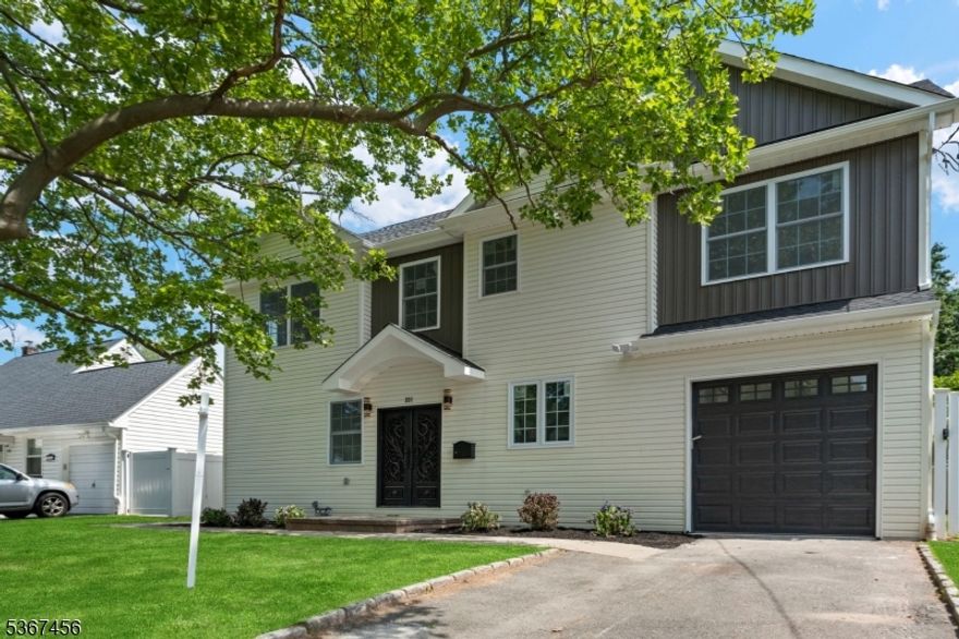 Welcome to this beautifully renovated home situated on a quiet street in the highly sought-after Clark Township. Conveniently located just minutes from Clark Commons, Warinanco Park, Rahway River Park, and the Garden State Parkway (Exit 135) for a quick commute to New York City, this residence offers both style and convenience.Boasting 4 bedrooms and 3.5 bathrooms, this home seamlessly combines modern elegance with functional design. The main floor features a spacious living room and dining area, along with a stunning open-concept kitchen outfitted with quartz countertops, stainless steel appliances, custom cabinetry, and a large center island perfect for gatherings and entertaining. A semi-finished basement provides additional flexible space for recreation, storage, or a home gym.Upstairs, the expansive primary suite includes an en-suite bathroom and walk-in closet. The second level also features three additional spacious bedrooms, a sleek full bathroom, and the convenience of a laundry room.This full renovation spared no detail, with all-new plumbing, electrical, framing, kitchen, and baths everything is brand new and move-in ready. Close to top-rated schools, Westfield's vibrant downtown, and the Rahway Train Station, this home truly delivers the perfect blend of comfort, location, and modern living.